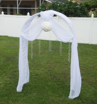 Outdoor ceremony arch draped in white chiffon and decorative strings of crystal beads. Photo and drapes by W Drapings.